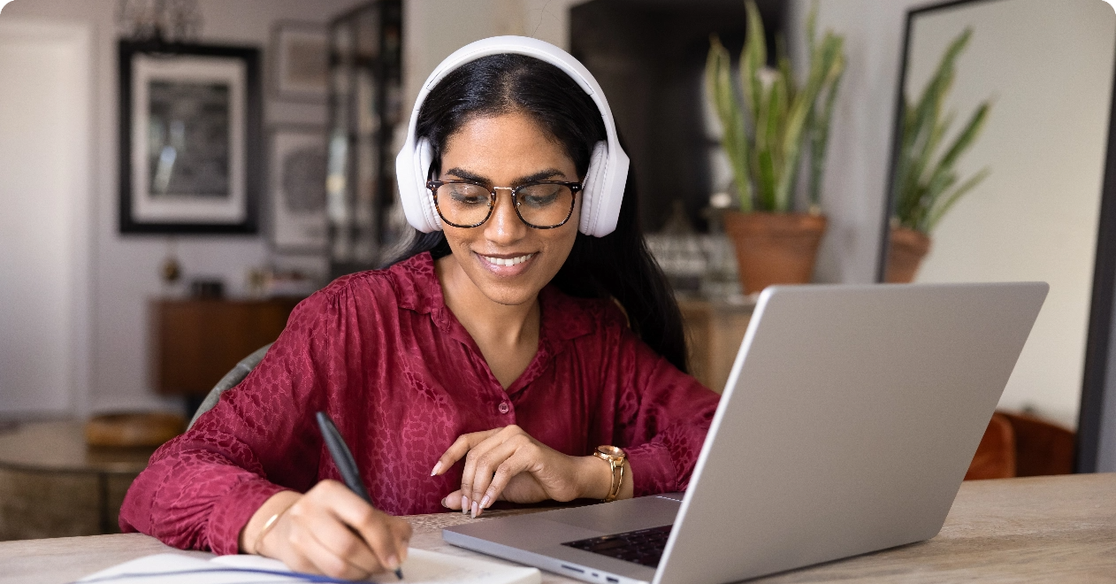 Woman learning online with headphones